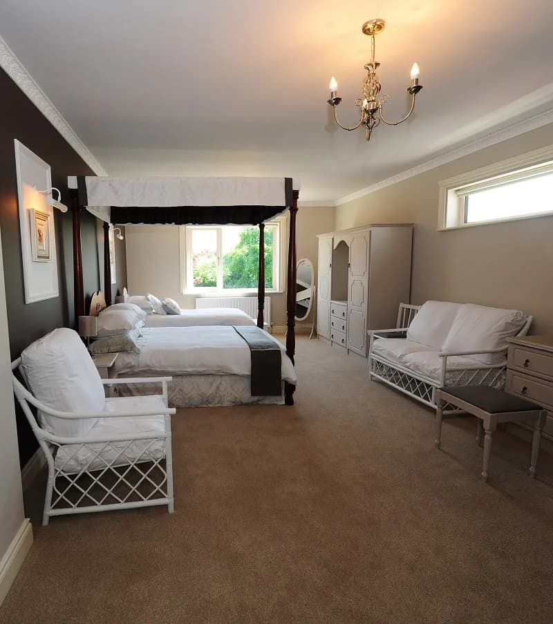 Room 4, with a mahogany four poster double bed and a separate single bed